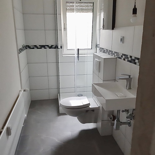 Gut vermietete Hochparterre-Wohnung mit drei Zimmern und Außenstellplatz! optimhome Immobilien Deutschland • Kaufen & Verkaufen